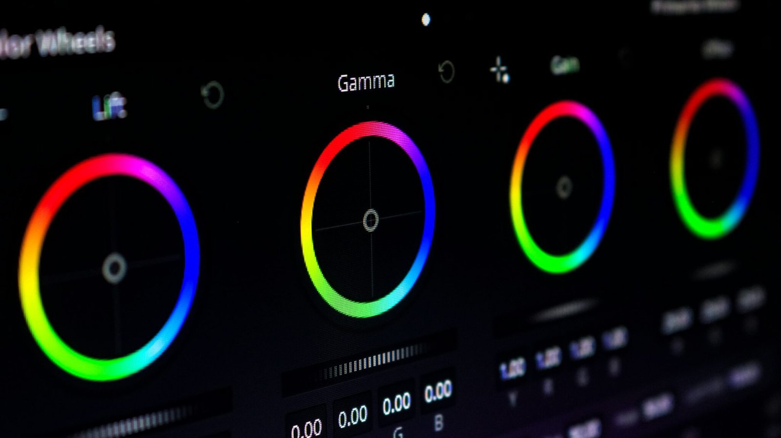 DaVinci Resolve color wheels on a grading monitor