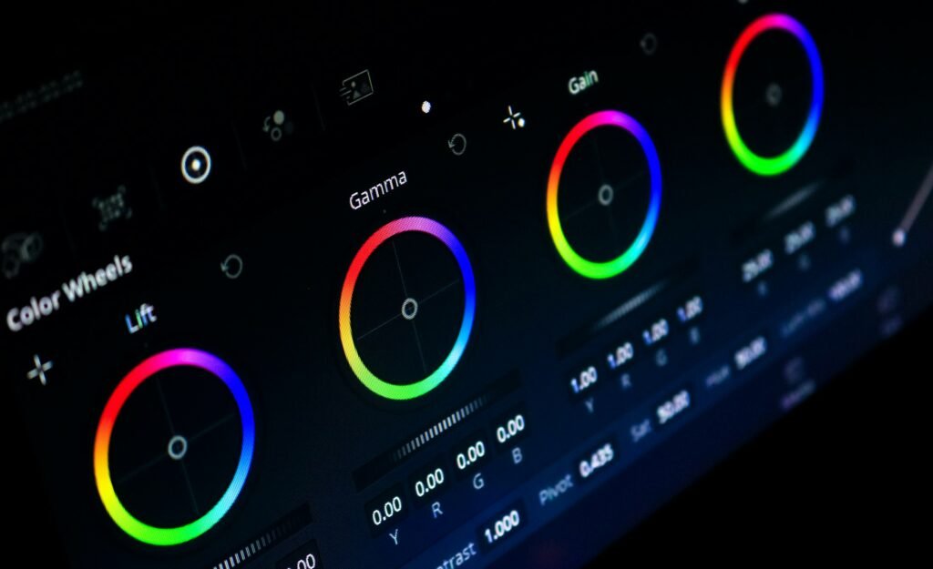 Color grading control panel with trackballs in a dim suite